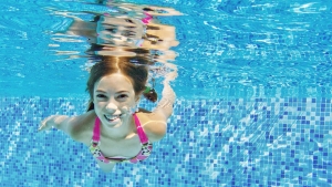 picture of a girl swimming underneath the water